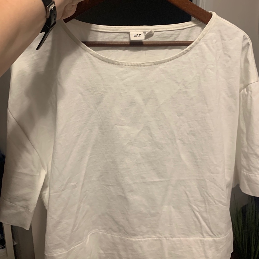 White top with bow on back